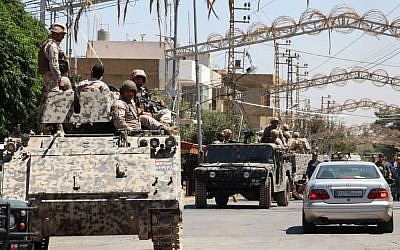 Lebanese army soldiers from the special forces unit patrol Qaa, a predominantly Lebanese Christian village near the Syrian border were suicide bombers blow themselves among civilians on Monday, eastern Lebanon, Tuesday, June 28, 2016. (AP Photo)