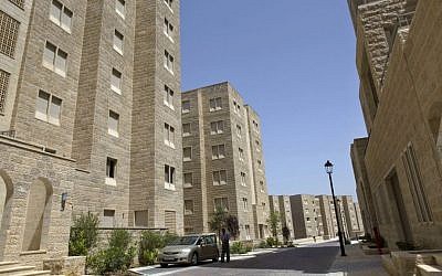 In this June 4, 2016 photo, a Palestinian resident arrives at his newly delivered apartment in the West Bank city of Rawabi, north of Ramallah. (AP Photo/Nasser Nasser)