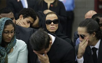 Muhammad Ali's wife, Lonnie (center), attends Muhammad Ali's Jenazah, a traditional Islamic Muslim service, in Louisville, Kentucky, on June 9, 2016. (AP/Darron Cummings)