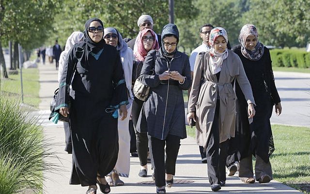People arrive at Freedom Hall for the Islamic funeral prayer service for Muhammad Ali Thursday, June 9, 2016, in Louisville, Ky. (AP Photo/Mark Humphrey)