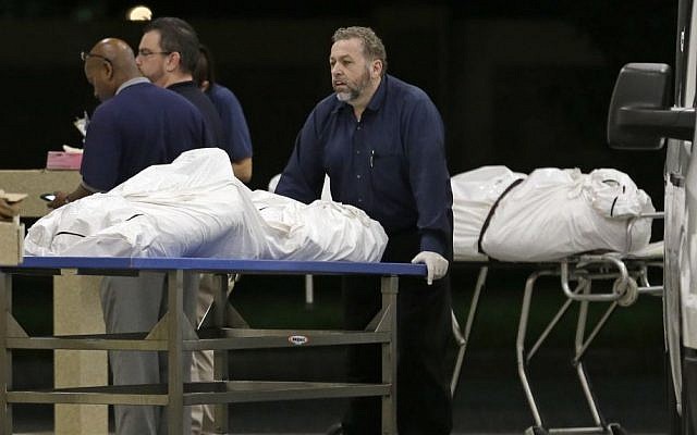 Two bodies of victims arrive at the Orlando Medical Examiner's Office, Sunday, June 12, 2016, in Orlando, Fla. A gunman opened fire inside a crowded gay nightclub early Sunday, killing 49 before dying in a gunfight with SWAT officers, police said. (AP Photo/Alan Diaz) Two bodies of victims arrive at the Orlando Medical Examiner's Office, Sunday, June 12, 2016, in Orlando, Fla. A gunman opened fire inside a crowded gay nightclub early Sunday, killing 49 before dying in a gunfight with SWAT officers, police said. (AP Photo/Alan Diaz)