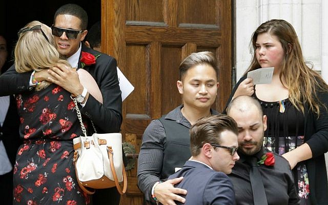 Mourners embrace and gather outside following the funeral service for Christopher Andrew Leinonen, one of the victims of the Pulse nightclub mass shooting, outside the Cathedral Church of St. Luke, Saturday, June 18, 2016, in Orlando, Florida. (AP Photo/John Raoux) Mourners embrace and gather outside following the funeral service for Christopher Andrew Leinonen, one of the victims of the Pulse nightclub mass shooting, outside the Cathedral Church of St. Luke, Saturday, June 18, 2016, in Orlando, Florida. (AP Photo/John Raoux)