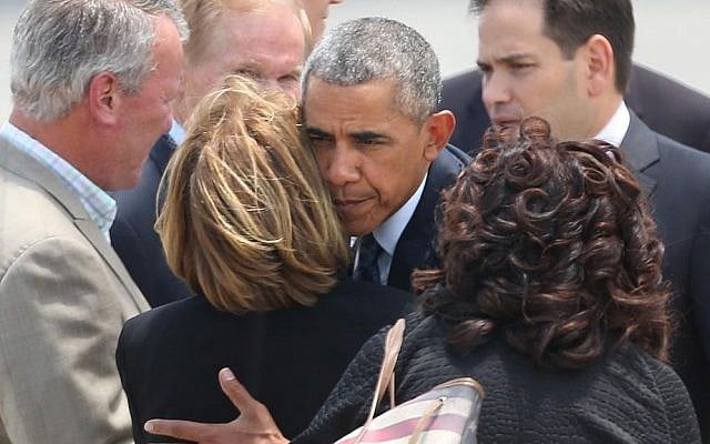 US President Barack Obama hugs Orange County Mayor Teresa Jacobs upon the president's arrival at Orlando International Airport, June 16, 2016, in Orlando, Florida. (Stephen M. Dowell/Orlando Sentinel via AP) US President Barack Obama hugs Orange County Mayor Teresa Jacobs upon the president's arrival at Orlando International Airport, June 16, 2016, in Orlando, Florida. (Stephen M. Dowell/Orlando Sentinel via AP)