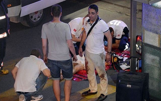 Turkish rescue services help a wounded person outside Ataturk Airport in Istanbul, Tuesday, June 28, 2016. (Ismail Coskun, IHA via AP) Turkish rescue services help a wounded person outside Ataturk Airport in Istanbul, Tuesday, June 28, 2016. (Ismail Coskun, IHA via AP)