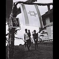 A photo of Prime Minister Levi Eshkol hangs in Libera in honor of his visit in June, 1966. (Moshe Fridan/GPO)