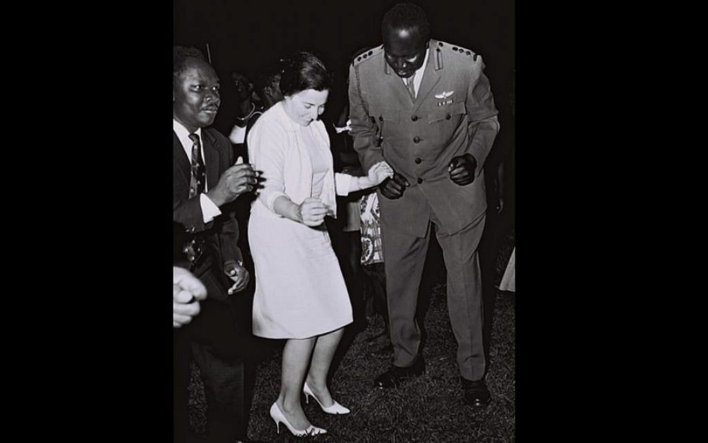 Miriam Eshkol, wife of Prime Minister Levi Eshkol, dancing with then Ugandan foreign minister Sam Odaka and army chief (and later president) Idi Amin on a visit to an army base outside Kampala, June, 1966. (GPO)