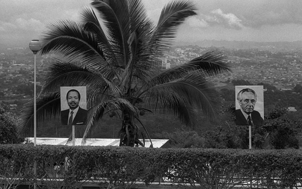 Images of Prime Minister Shimon Peres and Cameroonian President Paul Biya decorate the road to Yaoundé, Cameroon's capital city, August 25, 1986. (Nati Harnik/GPO)