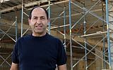 Rami Levy at the construction site for his new mall in Atarot, Jerusalem, June 21, 2016. ( Luke tress/Times of Israel)