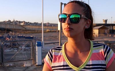 Amanda, a psychology student from Ramallah at the Qalandiya, says there is no problem with Israelis and Palestinians shopping together. (Luke Tress / Times of Israel.) 