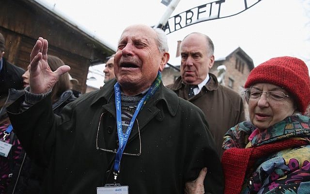 Ronald Lauder looks on as Mordechai Ronen, an inmate at Auschwitz at 11 who lost his parents and sisters there, breaks into tears as he walks through the camp, which is now a museum in Oswiecim, Poland, January 26, 2015. (Sean Gallup/Getty Images/via JTA) Ronald Lauder looks on as Mordechai Ronen, an inmate at Auschwitz at 11 who lost his parents and sisters there, breaks into tears as he walks through the camp, which is now a museum in Oswiecim, Poland, January 26, 2015. (Sean Gallup/Getty Images/via JTA)