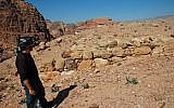 This undated handout image, provided by Dr. Christopher A. Tuttle, executive director of the Council of American Overseas Research Centers, shows him standing at the southwest corner of the interior, smaller platform, looking north, in Petra, Jordan. (Council of American Overseas Research Centers/ Q. Tweissi via AP)