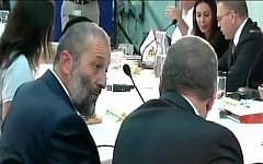 Interior Minister Aryeh Deri speaks to Defense Minister Avigdor Liberman, in comments that were caught on camera on June 2, 2016 (Channel 2 News)