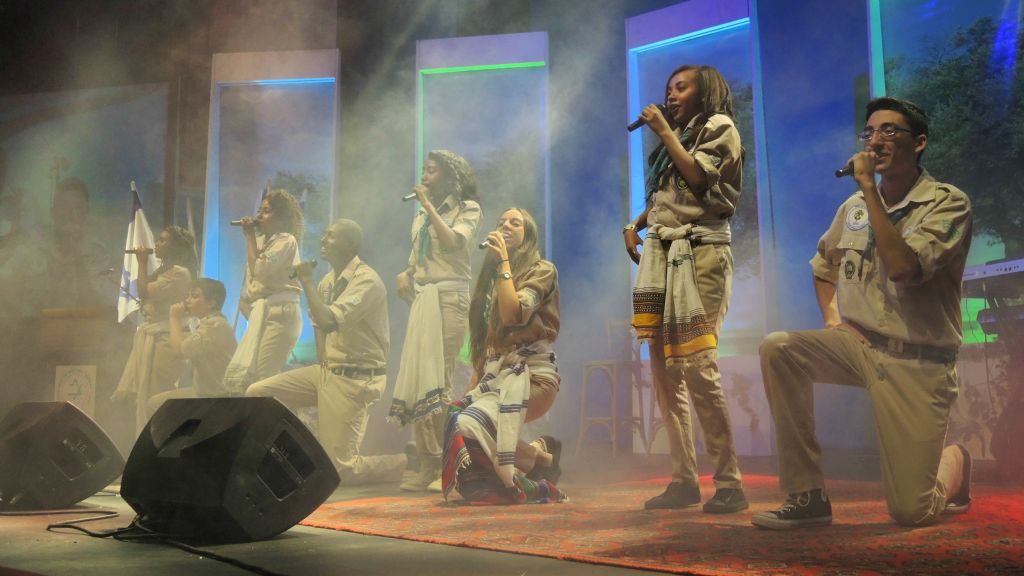 An Israeli scout groups sings a traditional Ethiopian song at the launch of the National Institute for Ethiopian Jewry Heritage Center in Jerusalem on June 19, 2016. (Melanie Lidman/Times of Israel)