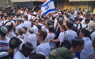 Religious Jews march through the Muslim Quarter of the Old City during the annual Jerusalem Day parade on June 5, 2016 (Judah Ari Gross)