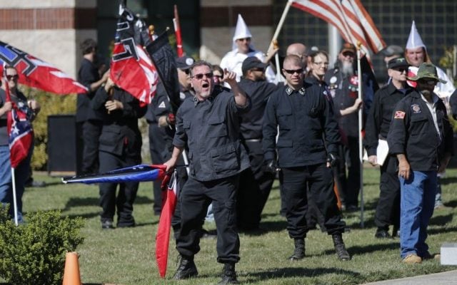 Members of the Ku Klux Klan participate in a "white pride" rally in Rome, Georgia, April 23, 2016. (AP Photo/John Bazemore)