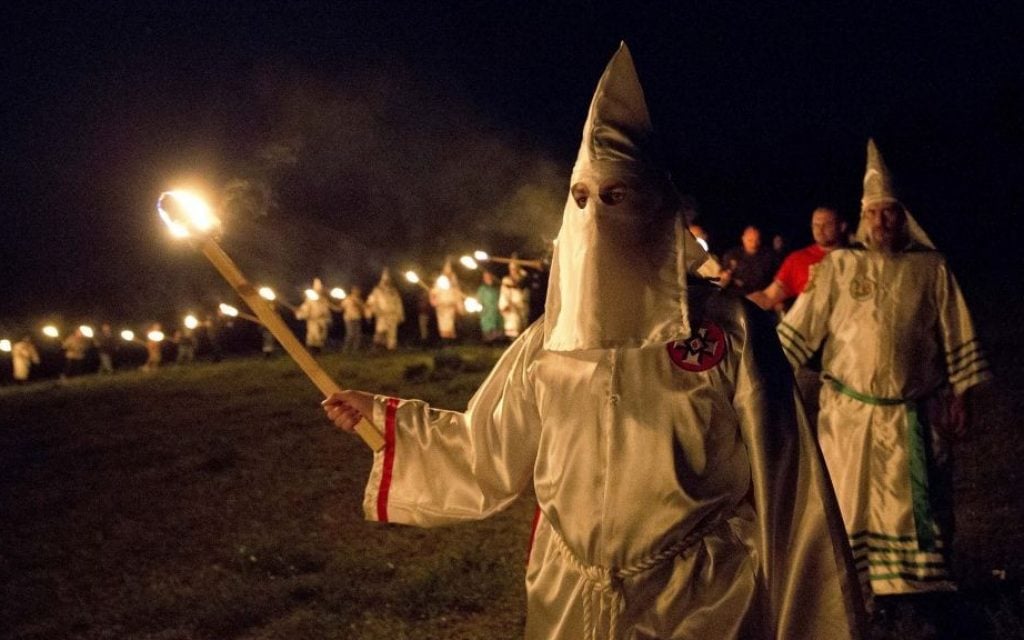 Illustrative: In this April 23, 2016 photo, members of the Ku Klux Klan participate in cross burnings after a 'white pride' rally in rural Paulding County near Cedar Town, Georgia. (AP Photo/John Bazemore) Illustrative: In this April 23, 2016 photo, members of the Ku Klux Klan participate in cross burnings after a 'white pride' rally in rural Paulding County near Cedar Town, Georgia. (AP Photo/John Bazemore)