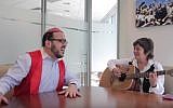 Hasidic singer Lipa Schmeltzer with Israeli composer Corinne Allal (YouTube screenshot)