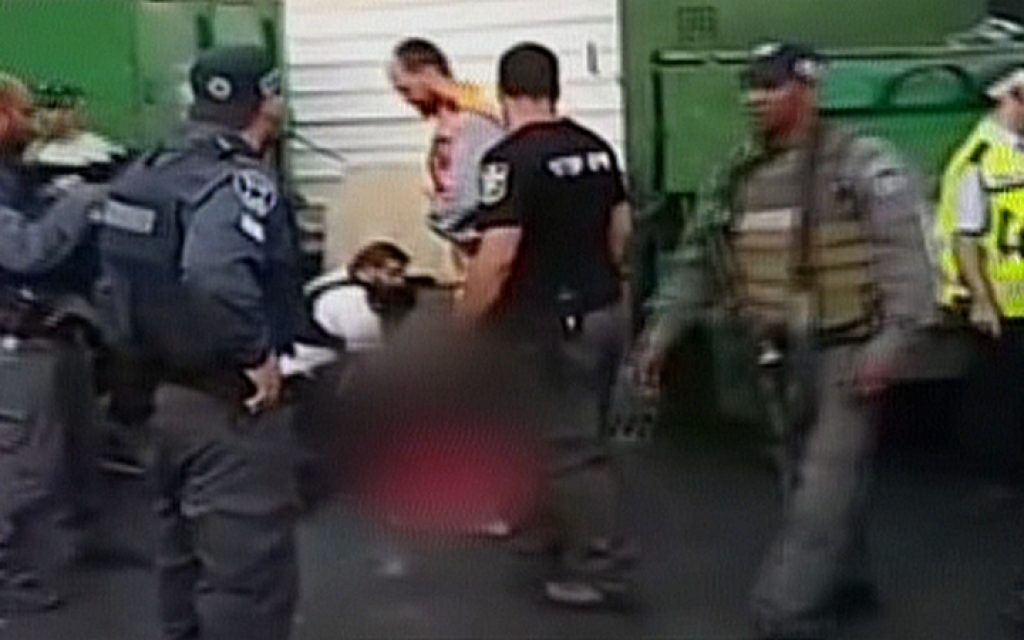 Israeli police at the scene of a suspected stabbing attack in the coastal city of Netanya on June 30, 2016 (screen capture: Channel 2)
