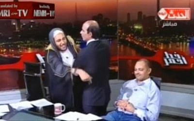 A still image from a May 27, 2016, Egyptian TV show in which a cleric tries to attack an astrologist over an end of the world prediction. (Memri screenshot) A still image from a May 27, 2016, Egyptian TV show in which a cleric tries to attack an astrologist over an end of the world prediction. (Memri screenshot)