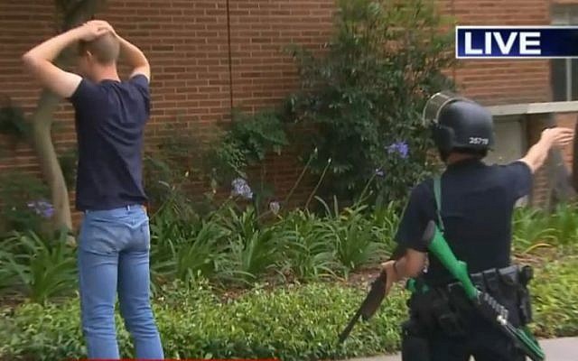 Police searching a man on the UCLA campus after a shooting on June 1, 2016. (screen capture: KTLA)