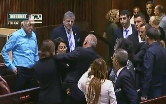 Joint (Arab) List MK Hanin Zoabi, center, rows with fellow lawmakers in the Knesset plenum over her comments on the Israel-Turkey reconciliation agreement on June 29, 2016 (screen capture: Knesset Channel) Joint (Arab) List MK Hanin Zoabi, center, rows with fellow lawmakers in the Knesset plenum over her comments on the Israel-Turkey reconciliation agreement on June 29, 2016 (screen capture: Knesset Channel)