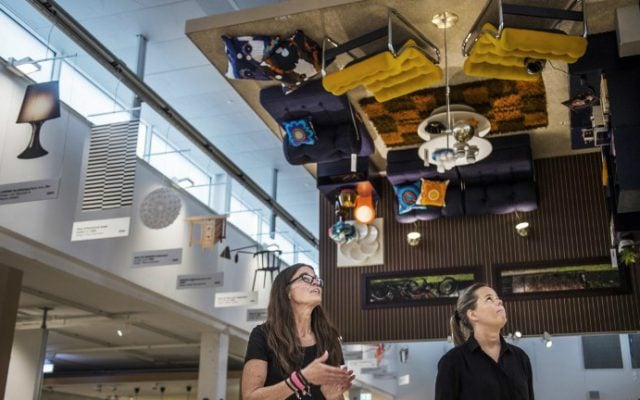 Ikea creative leader Cia Eriksson, left, and information officer Johanna Blomqvist, give a tour at the Ikea Museum in Almhult, Sweden, on June 14, 2016. (Emil Langvad/TT News Agency/AFP)