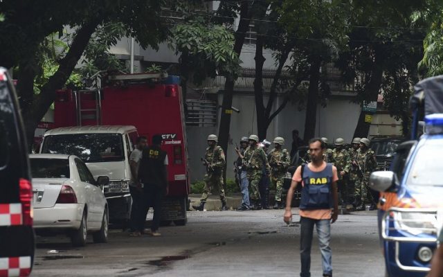 Bangladeshi army soldiers patrol a street during a rescue operation as gunmen take position in a restaurant in the Dhakas high-security diplomatic district on July 2, 2016. (AFP PHOTO/APF/STR) Bangladeshi army soldiers patrol a street during a rescue operation as gunmen take position in a restaurant in the Dhakas high-security diplomatic district on July 2, 2016. (AFP PHOTO/APF/STR)