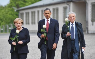 This June 5, 2009 photo shows former US President Barack Obama (C), German Chancellor Angela Merkel and Holocaust survior Elie Wiesel making their way to pay their respects at a memorial during a visit to the former Buchenwald concentration camp near Weimar in Germany. (AFP PHOTO / MANDEL NGAN)