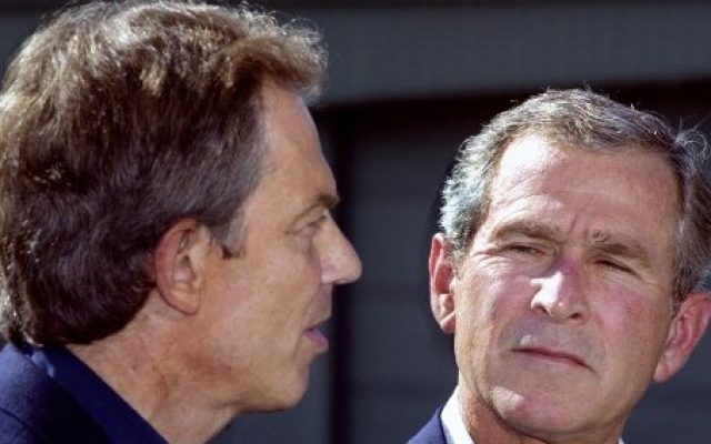 Then-President George W. Bush looking at then-British Prime Minister Tony Blair as they deliver statements to the media after Blair's arrival at the US presidential retreat, Camp David, Maryland, September 7, 2002. (AFP/Paul J. Richards) Then-President George W. Bush looking at then-British Prime Minister Tony Blair as they deliver statements to the media after Blair's arrival at the US presidential retreat, Camp David, Maryland, September 7, 2002. (AFP/Paul J. Richards)