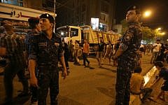 Iraqi security forces keep watch in Baghdad on July 5, 2016, at the site of a previous car bomb attack. (AFP/Ahmad al-Rubaye, File)