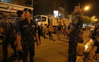 Iraqi security forces keep watch in Baghdad on July 5, 2016, at the site of a previous car bomb attack. (AFP/Ahmad al-Rubaye, File)