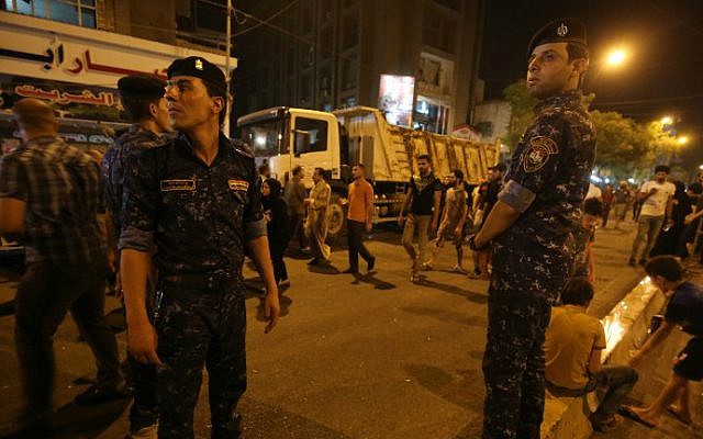Iraqi security forces keep watch in Baghdad on July 5, 2016, at the site of a previous car bomb attack. (AFP/Ahmad al-Rubaye, File) Iraqi security forces keep watch in Baghdad on July 5, 2016, at the site of a previous car bomb attack. (AFP/Ahmad al-Rubaye, File)