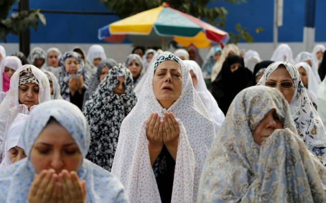 Iranian Muslim women perform Eid al-Fitr prayers in western Tehran on July 06, 2016.(AFP PHOTO / ATTA KENARE)