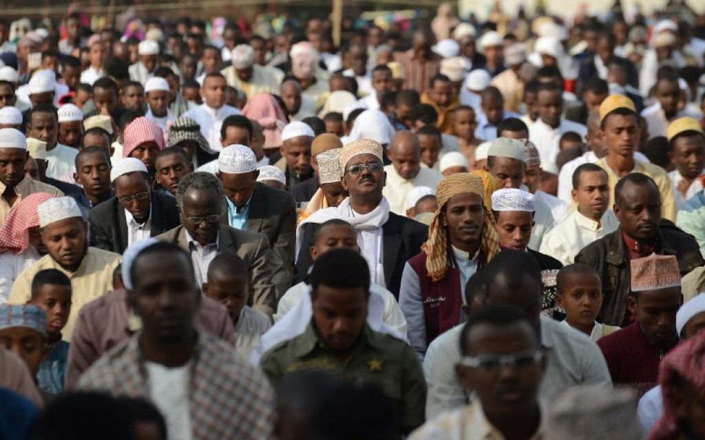 Men pray during the Eid al-Fitr celebrations in Nairobi on July 6, 2016.(AFP PHOTO / SIMON MAINA)