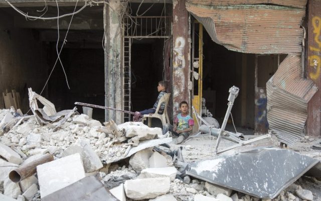 Syrian children sit amidst the rubble of destroyed buildings on July 6, 2016 in the rebel-held district of Tariq al-Bab of the northern city of Aleppo. (AFP PHOTO/KARAM AL-MASRI) Syrian children sit amidst the rubble of destroyed buildings on July 6, 2016 in the rebel-held district of Tariq al-Bab of the northern city of Aleppo. (AFP PHOTO/KARAM AL-MASRI)