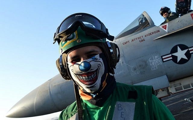 A sailor stands near an An F/A-18E Super Hornet on the US navy's super carrier USS Dwight D. Eisenhower (CVN-69) ("Ike") in the Mediterranean Sea on July 6, 2016. (AFP PHOTO / ALBERTO PIZZOLI) A sailor stands near an An F/A-18E Super Hornet on the US navy's super carrier USS Dwight D. Eisenhower (CVN-69) ("Ike") in the Mediterranean Sea on July 6, 2016. (AFP PHOTO / ALBERTO PIZZOLI)