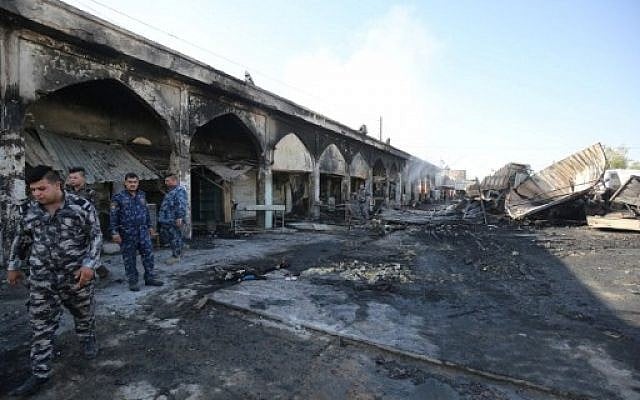 Iraqi policemen inspect the aftermath scene of a mortar and bombing attack on the Sayyid Mohammed shrine in the Balad area, located 70 kilometers (around 45 miles) north of Baghdad, on July 8, 2016. (AFP/Ahmad al-Rubaye) Iraqi policemen inspect the aftermath scene of a mortar and bombing attack on the Sayyid Mohammed shrine in the Balad area, located 70 kilometers (around 45 miles) north of Baghdad, on July 8, 2016. (AFP/Ahmad al-Rubaye)