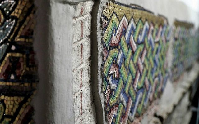 A close up shot shows details of a renovated mosaic wall inside the Church of the Nativity, renovated by Italian experts, in the biblical West Bank town of Bethlehem on July 8, 2016. (Thomas Coex/AFP)