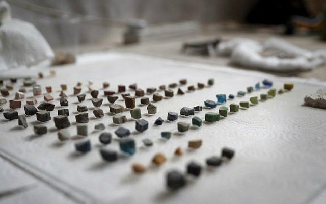 A close up shot shows mosaic cubes used to renovate the antique walls inside the Church of the Nativity in the biblical West Bank town of Bethlehem on July 8, 2016. (Thomas Coex/AFP)