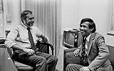 This image courtesy of The New York Times, shows New York Times correspondent Sydney Schanberg (L) talking with colleague Dith Pran in The Times office in New York on January 15, 1980. (AFP PHOTO / The New York Times)
