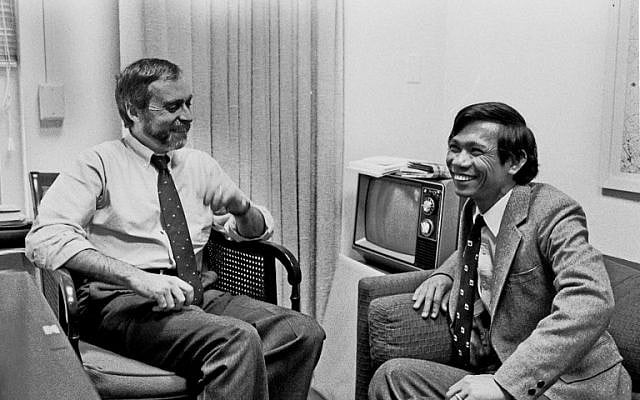 This image courtesy of The New York Times, shows New York Times correspondent Sydney Schanberg (L) talking with colleague Dith Pran in The Times office in New York on January 15, 1980. (AFP PHOTO / The New York Times) This image courtesy of The New York Times, shows New York Times correspondent Sydney Schanberg (L) talking with colleague Dith Pran in The Times office in New York on January 15, 1980. (AFP PHOTO / The New York Times)