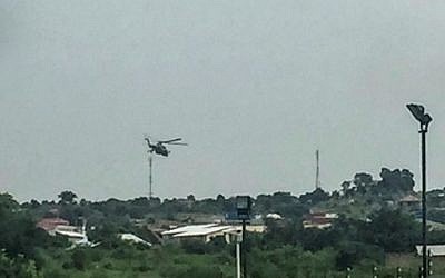 South Sudanese government attack helicopters hover over the Checkpoint district of the capital Juba, near the Jebel district which has seen some of the heaviest fighting, on July 11, 2016.  (AFP PHOTO / STR)