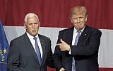 Presumptive US Republican presidential candidate Donald Trump (R) and Indiana Governor Mike Pence take the stage during a campaign rally at Grant Park Event Center in Westfield, Indiana, on July 12, 2016.  (AFP Photo/Tasos Katopdis)