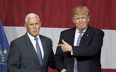 Presumptive US Republican presidential candidate Donald Trump (R) and Indiana Governor Mike Pence take the stage during a campaign rally at Grant Park Event Center in Westfield, Indiana, on July 12, 2016.  (AFP Photo/Tasos Katopdis)