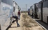 Illustrative: Buses received on July 13, 2016, on the Palestinian side of Israel's Erez border crossing with the Gaza Strip in the first such delivery since 2007. (AFP Photo/Mahmud Hams)
