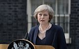 Britain's new Prime Minister Theresa May speaks outside 10 Downing Street in central London on July 13, 2016. (AFP/OLI SCARFF)