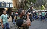 A Lebanese gunman during the funeral procession of Hamad al-Moqdad, one of the Lebanese victims of a car bomb attack that killed dozens in a Beirut stronghold of terror group Hezbollah on August 16, 2013.(AFP PHOTO / ANWAR AMRO )