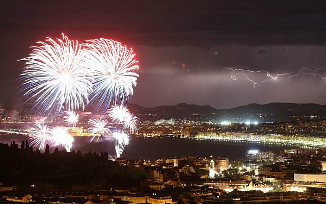 A picture taken on July 14, 2016 shows a flash of lightning as fireworks explode over the French Riviera city of Nice, southeastern France, as part of France's annual Bastille Day Celebrations. (Valery Hache/AFP) A picture taken on July 14, 2016 shows a flash of lightning as fireworks explode over the French Riviera city of Nice, southeastern France, as part of France's annual Bastille Day Celebrations. (Valery Hache/AFP)