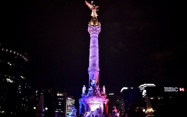 Mexican Independence Angel monument is illuminated with the colors of the French national flag on July 14, 2016 in Mexico City in solidarity following the deadly attack in Nice, France. (AFP PHOTO / YURI CORTEZ)