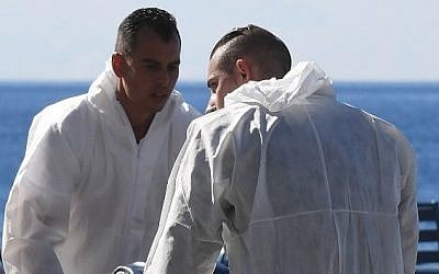 Forensics experts evacuate a dead body on the Promenade des Anglais seafront in the French Riviera town of Nice on July 15, 2016, after a gunman smashed a truck into a crowd of revellers celebrating Bastille Day. (AFP PHOTO / BORIS HORVAT) Forensics experts evacuate a dead body on the Promenade des Anglais seafront in the French Riviera town of Nice on July 15, 2016, after a gunman smashed a truck into a crowd of revellers celebrating Bastille Day. (AFP PHOTO / BORIS HORVAT)